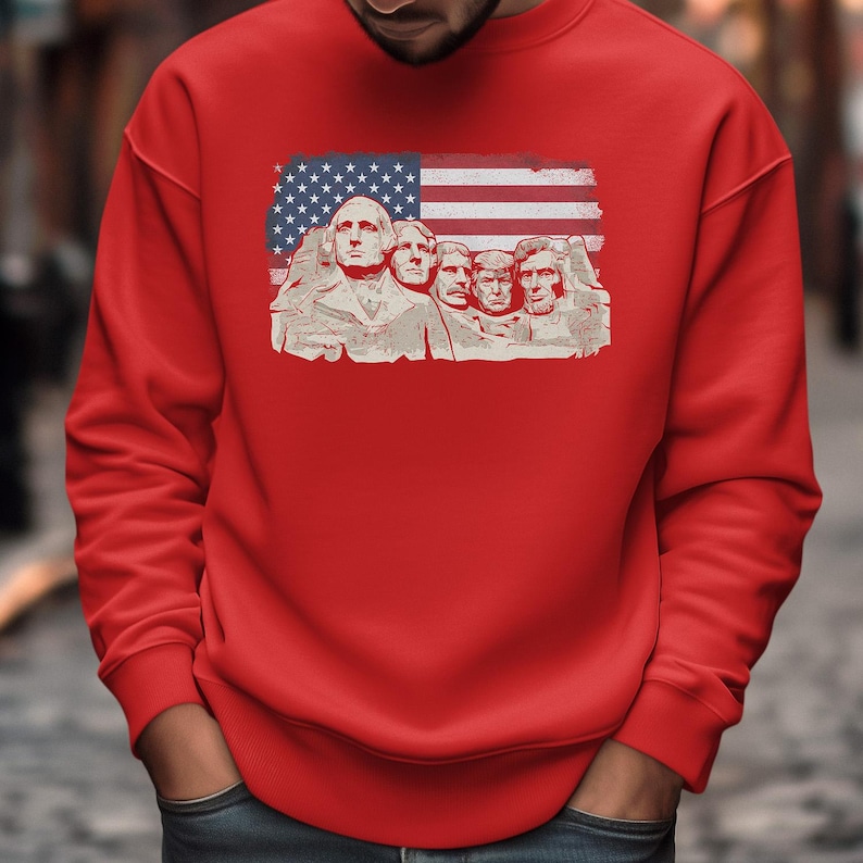A red sweatshirt with an American flag design featuring the Statue of Liberty.