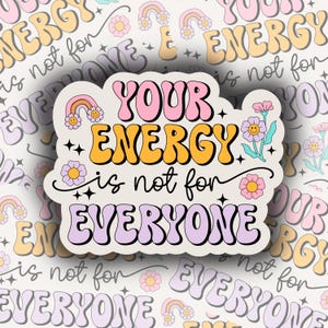 Puede incluir: Una pegatina con el texto "YOUR ENERGY is not for EVERYONE" en rosa, naranja y morado. El diseño incluye motivos florales y arcoíris. El fondo tiene un patrón repetido con el mismo texto y elementos florales.