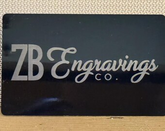 May include: A black business card with the text "ZB Engravings Co." in silver lettering.