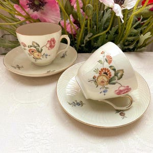 Price is for 1 Cup and 1 Saucer. Wild Peony Royal Copenhagen Frijsenborg. Off White Cup and Saucer Set with Gold Trim. Vintage 1950-1960s