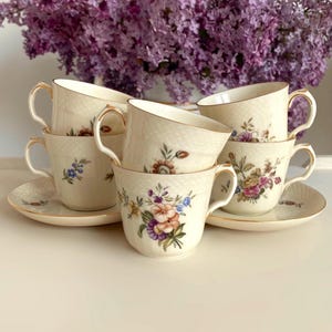 Price is for 1 Cup and 1 Saucer. Assorted Frijsenborg Botanical Motive Royal Copenhagen 910-1546 Demitasse Cup and Saucer Set. First Class