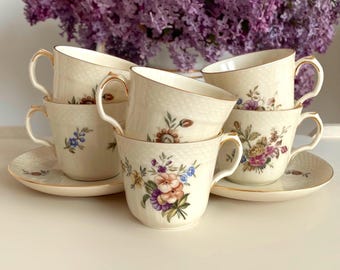 Price is for 1 Cup and 1 Saucer. Assorted Frijsenborg Botanical Motive Royal Copenhagen 910-1546 Demitasse Cup and Saucer Set. First Class