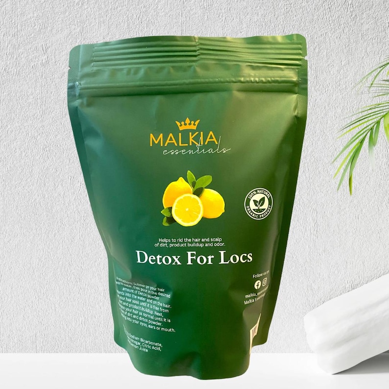 May include: A green pouch of "Detox For Locs" hair care product by Malkia Essentials. The package features a lemon graphic and text indicating it helps rid hair of dirt and product buildup. The product is labeled as 100% natural.