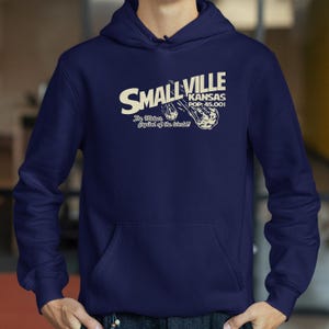 A navy blue hoodie with text and graphics printed on it.