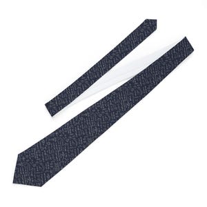 May include: A navy blue tie with a white interior. The tie is covered in a repeating pattern of small, light gray symbols and text. The tie is angled, showing the front and back.
