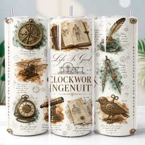 May include: A cylindrical tumbler featuring a vintage-style print with scientific illustrations including a compass, an open anatomical book, a quill in an inkwell, a mechanical bird, and a pocket watch, with the text "Life Is Good" and "CLOCKWORK INGENUITY".
