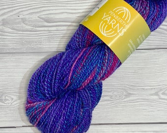 Handspun Hand Dyed Superwash Cheviot Wool in Blue, Pink and Purple. A Sport Weight Yarn approximately 81 grams.