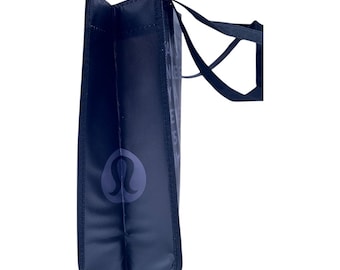 Bolso tote negro Lululemon: Reutilizable, poliéster, ideal para yoga, gimnasio y playa.