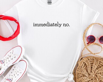 May include: White t-shirt with the text "immediately no." printed in black.