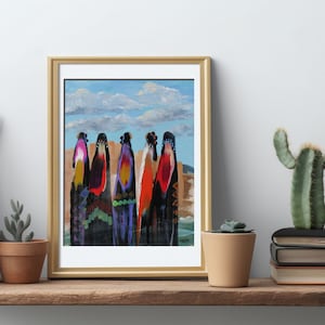 May include: A framed painting of five women in colorful robes standing in front of a desert landscape. The sky is blue with white clouds. The painting is in a gold frame.
