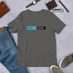 May include: A dark gray t-shirt with a blue and black rectangle featuring the text "HAL 9000".