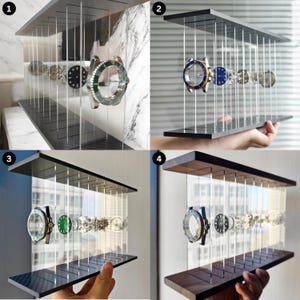 May include: A rectangular watch display stand featuring two horizontal wooden planks connected by vertical clear acrylic rods. The design suspends multiple watch cases and dials in a floating arrangement between the top and bottom panels.