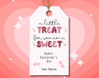 May include: White gift tag with pink and red text that reads "a little +TREAT+ for someone +SWEET+" and "HAPPY VALENTINE'S DAY" with the name "MADELINE" at the bottom.