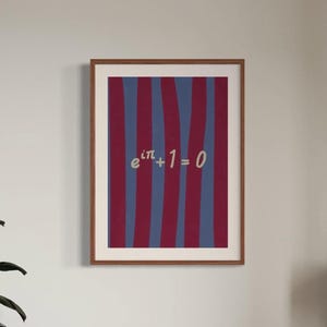 May include: A framed print with a striped background in shades of burgundy and blue. The print features the mathematical equation "e^(iπ) + 1 = 0" in white text.