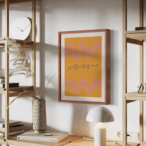 May include: A framed print with a yellow and pink abstract design. The print features a mathematical equation: 1/2 * g * t^2 + 2 * V * t + 2 * S * t^2 + 2 * K * t^2 + V^2 = 0