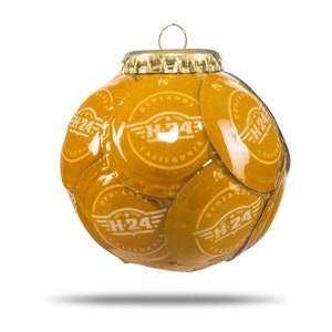 May include: A gold Christmas ornament made from bottle caps with the logo "H-24 Redlands California" repeated on each cap.