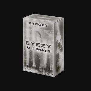 Op de afbeelding: Een rechthoekige productdoos in grijstinten en wit met de tekst EYECEY en EYEZY ULTIMATE op de voorzijde. De doos toont een monochrome afbeelding van een silhouet van een figuur in een mistige omgeving met een Shopify-logo.