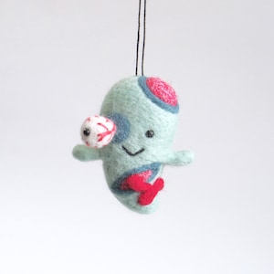 miniature needle felted zombie ornament with black hemp string