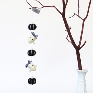 Needle felted miniature short garland with 3 black felted pumpkins + 2 felted white baby ghost with black and white plaid ribbons.