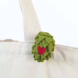 Felt beer hop brooch with tiny red felt heart.