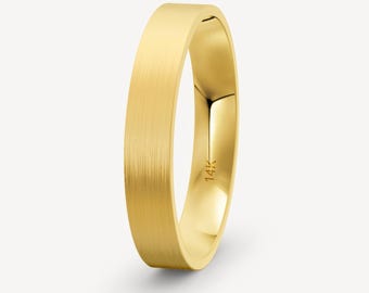 May include: A simple gold wedding band with a brushed finish. The band is marked "14K" on the inside.