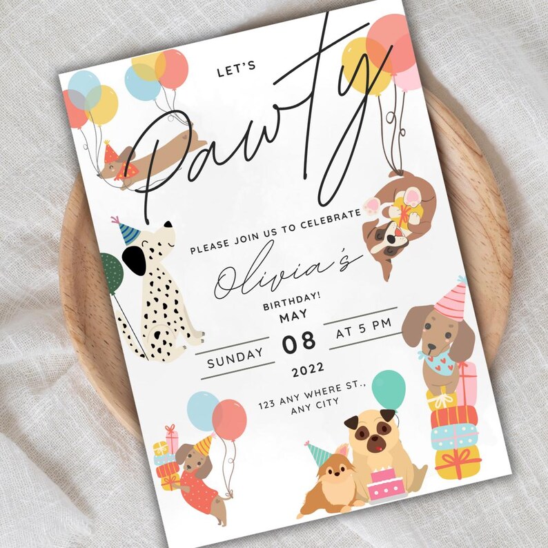 Close-up of dog birthday invitation design, showing dogs with party hats and holding colorful balloons, with presents nearby