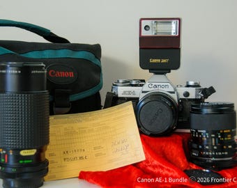 Canon AE-1, x3 obiettivi, flash, borsa, nuove guarnizioni