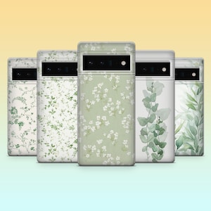 May include: Five phone cases with floral and botanical designs. The cases feature various patterns, including white flowers on a green background, and green leaves. The cases are arranged in a row, showcasing their different designs.