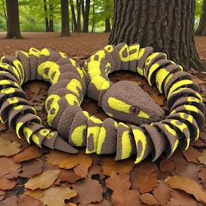 May include: A segmented articulated snake toy featuring a textured brown and bright yellow pattern. The snake has a distinct head with a visible eye and a body composed of multiple interlocking pieces that allow for flexible movement and posing.