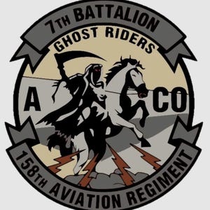 May include: A circular patch featuring a grim reaper riding a white horse, with the text "7th Battalion Ghost Riders" and "158th Aviation Regiment". The design includes lightning bolts and the letters "A" and "CO".