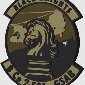 May include: A black and tan military patch with a black knight chess piece, a helicopter, and the text "BLACK KNIGHTS B Co 2-501st GSAB".