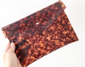 Tortoiseshell vinyl plastic envelope clutch