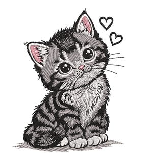 May include: An embroidered design of a gray and black tabby kitten with large eyes and pink inner ears. Two black hearts float above the kitten's head. The kitten is sitting and looking up with a sweet expression.