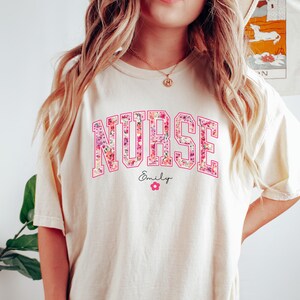 Comfort Colors Pink Nurse Shirt, Floral RN Tee with Custom Name, Personalized Nursing School T-Shirt, Graduation Gift, Nurse Appreciation