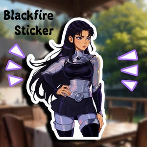 May include: Blackfire Sticker featuring a female character with long black hair, wearing a black and silver outfit with a silver belt and a black skirt. The character is standing with her hand on her hip and looking to the right.
