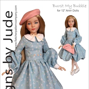 May include: A sewing pattern for a 12-inch doll dress called "Burst My Bubble" designed by Tamara Casey. The dress is blue with a white floral print and has a white collar and cuffs. The doll is wearing a pink beret and white shoes.