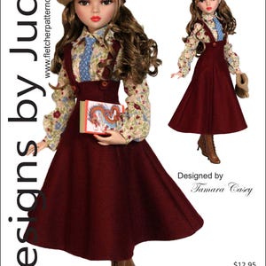 Puede incluir: Una muñeca con un vestido burdeos, una blusa floral y una boina color canela. La muñeca sostiene un libro con una ilustración de un dragón. La imagen incluye el texto "Designs by Jude" y "VDC Collaboration Oxford Society for 16" Ellowyne Wilde Dolls."