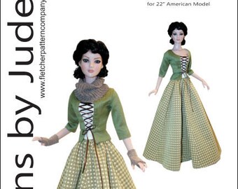 May include: A sewing pattern for a green and white gingham dress with a green jacket. The pattern is for a 22 inch doll and is called "Scottish Claire". The pattern is designed by Tamara Casey.