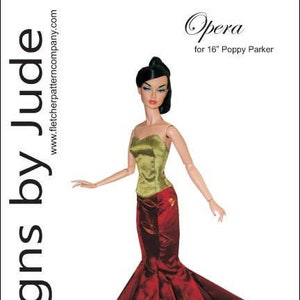 May include: A sewing pattern for a red and green gown with a fitted bodice and a full skirt. The pattern is for a 16-inch Poppy Parker doll. The pattern is called "Opera" and is by Designs by Jude.