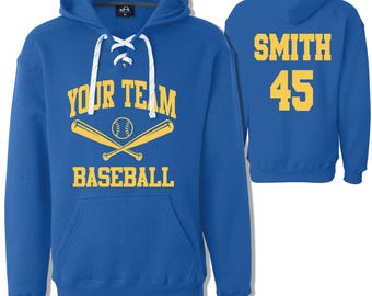 May include: Royal blue hooded sweatshirt with a white lace-up neckline. The front features a yellow baseball graphic with the text "Your Team Baseball". The back features the text "Smith 45" in yellow.