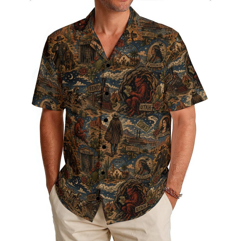 May include: Short-sleeved button-down shirt with a detailed, vintage-style print. The design features illustrations of cowboys, Native Americans, and desert landscapes in shades of brown, blue, and tan. The shirt has a classic collar and button closure.
