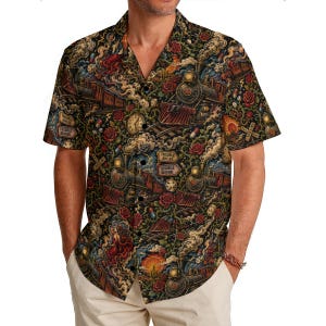 May include: Short-sleeved button-down shirt with a dark background and a repeating pattern of steam trains, roses, and the text "Trouble Ahead" and "Trouble Behind". The shirt has a classic collar and is worn open.