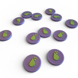 May include: A collection of purple game tokens with a green teardrop design. The tokens are round and scattered across a white surface. The teardrop design has three small circles at the bottom.