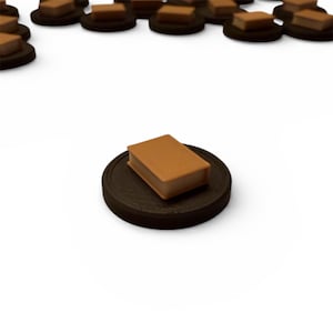 May include: A collection of miniature brown books on black circular bases. The books have a textured cover and are arranged against a white background. The objects appear to be game pieces or decorative items.
