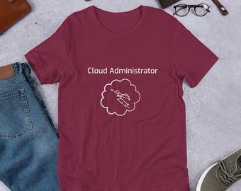 May include: Burgundy short-sleeved t-shirt with white text that reads "Cloud Administrator" and a graphic of a person flying in the clouds.