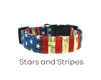 May include: A red, white, and blue dog collar with a stars and stripes pattern. The collar is made of fabric and has a black plastic buckle.