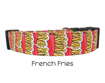 May include: A red, white, and yellow dog collar with a pattern of french fries. The collar has a black buckle and is labeled "French Fries".