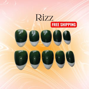 May include: A set of dark green oval press-on nails with white tips. The word "Rizz" is displayed in black script at the top left. The background is a gradient of orange and white.