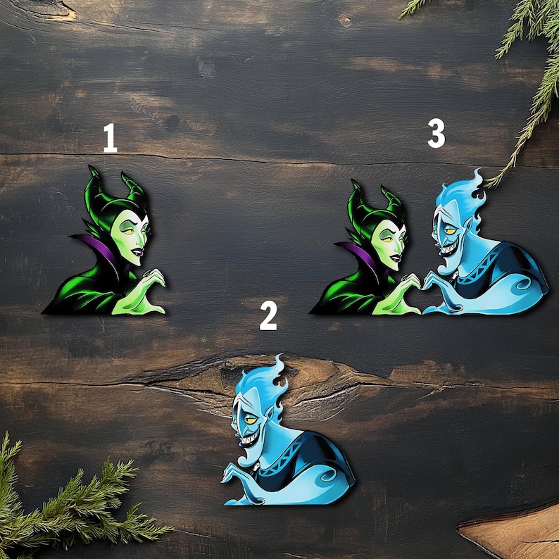 May include: Three cartoon character cutouts. One features a green-skinned woman with black horns and a purple collar. Another shows a blue-skinned man with flames for hair. The third shows the woman and man forming a heart with their hands.
