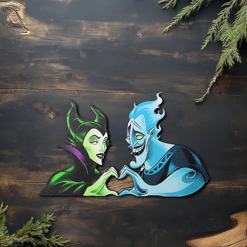 May include: A wooden cutout featuring the characters Maleficent and Hades from Disney's animated films. Maleficent is depicted in green and black, while Hades is blue. They are positioned with their hands forming a heart shape. The background is dark wood.